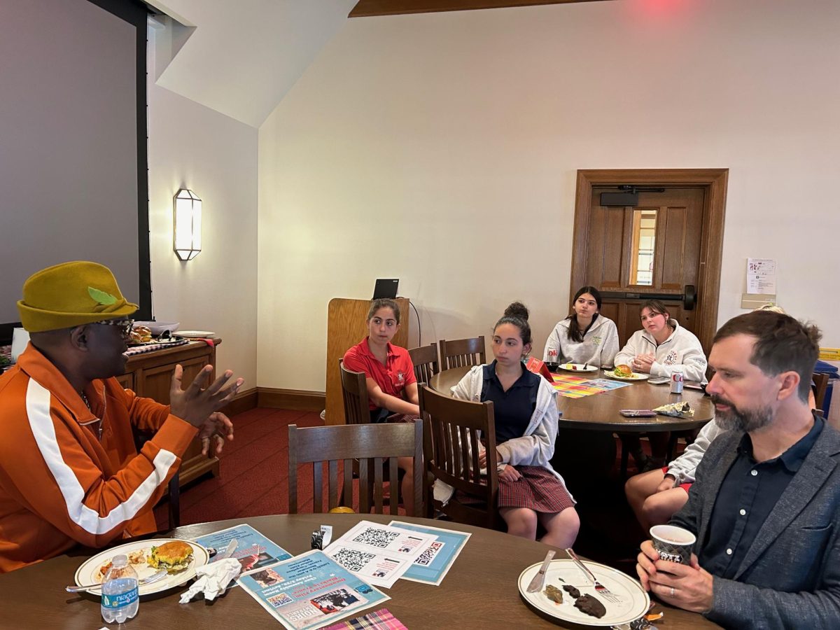 Mabanckou shares his story with French students Avi Hayon, Bryanna Micu, Kai Gomez and Talulah Monthy. Photo used with permission of Shelly Stein. 