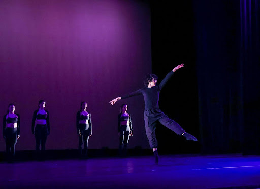 Freshman Joshua Jones performs a solo section during Kai Gomez’s lyrical piece "Can You Loosen Orion’s Belt?", featuring a graceful arabesque and a la secondes.  
