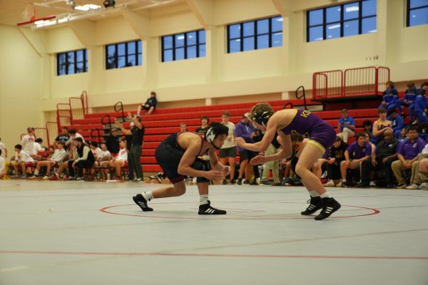 Braden Lane — a Sophomore wrestler — crushes his Kinkaid opponent at City Duals. 

Courtesy of Braden Lane